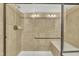 Shower featuring a glass door, tiled walls, and a built-in bench at 520 Brier Crossings Loop, Durham, NC 27703