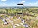 Aerial view of a neighborhood with homes surrounded by trees, 4.7 miles from Zebulon at 62 Narmada Ct, Zebulon, NC 27597
