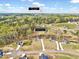 Aerial view of a neighborhood nestled among trees, with a pin indicating its location 5.8 miles from I-587 at 62 Narmada Ct, Zebulon, NC 27597