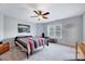 Cozy bedroom with a ceiling fan and bright window at 62 Narmada Ct, Zebulon, NC 27597