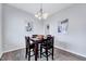 Cozy dining area with hardwood floors and a chandelier at 62 Narmada Ct, Zebulon, NC 27597