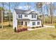 Attractive two-story home with a landscaped yard and inviting front porch at 62 Narmada Ct, Zebulon, NC 27597
