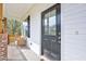 Close-up of a welcoming front porch and front door at 62 Narmada Ct, Zebulon, NC 27597