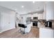 Modern kitchen featuring granite countertops, stainless steel appliances, and an island with seating at 62 Narmada Ct, Zebulon, NC 27597