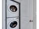Efficient laundry area with stacked washer and dryer at 62 Narmada Ct, Zebulon, NC 27597