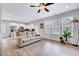 Open living area seamlessly connects to the kitchen, highlighted by natural light and neutral tones at 62 Narmada Ct, Zebulon, NC 27597