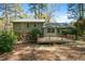 Expansive backyard features a spacious deck and lush greenery, perfect for outdoor gatherings at 704 Emory Dr, Chapel Hill, NC 27517