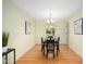 Classic dining room featuring hardwood floors, a chandelier, and a view to the exterior at 704 Emory Dr, Chapel Hill, NC 27517