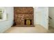 A cozy fireplace with a brick surround and wooden mantel makes a stunning feature at 704 Emory Dr, Chapel Hill, NC 27517