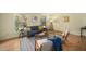 Sunlit living room offering hardwood floors, a comfortable sofa, and natural light at 704 Emory Dr, Chapel Hill, NC 27517