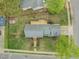 Overhead shot shows house with a deck and tidy yard, capturing its peaceful setting on a well-maintained street at 8000 Old Deer Trl, Raleigh, NC 27615