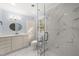 Updated bathroom featuring marble floors, shaker cabinets, and glass enclosed shower at 8000 Old Deer Trl, Raleigh, NC 27615