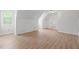 Bright bonus room with a window and wood-look floors at 8000 Old Deer Trl, Raleigh, NC 27615
