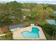 Aerial view of the sparkling blue community pool, surrounded by lush trees and greenery at 8000 Old Deer Trl, Raleigh, NC 27615