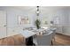 Elegant dining room with modern lighting, sleek table, and sophisticated decor, perfect for intimate gatherings at 8000 Old Deer Trl, Raleigh, NC 27615