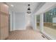 Bright dining room with floor to ceiling windows and wood floors at 8000 Old Deer Trl, Raleigh, NC 27615