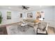 Bright living room featuring stylish furnishings, a modern rug, and ample natural light, creating an inviting atmosphere at 8000 Old Deer Trl, Raleigh, NC 27615