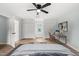 Spacious main bedroom featuring an en-suite bathroom, walk-in closets, and a comfortable work space at 8000 Old Deer Trl, Raleigh, NC 27615