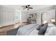 Serene main bedroom with ample closet space, a cozy work area, and soft lighting for a relaxing retreat at 8000 Old Deer Trl, Raleigh, NC 27615