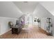 Bright office space with hardwood floors, desk, and plenty of natural light at 8000 Old Deer Trl, Raleigh, NC 27615