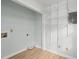 Walk-in closet with wood look floors and adjustable storage shelves at 8000 Old Deer Trl, Raleigh, NC 27615