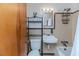 Cozy bathroom featuring classic tile work, a convenient storage rack, and a combined tub and shower unit at 808 N Franklin Dr, Sanford, NC 27330
