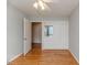 A bedroom with hardwood floors, a ceiling fan and custom built-in closets and cabinets at 808 N Franklin Dr, Sanford, NC 27330