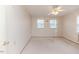 A bedroom with carpet, white walls, and natural light from double hung windows at 808 N Franklin Dr, Sanford, NC 27330