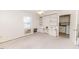 Bedroom with carpeting, built-in shelves and cabinets, and a view into the laundry area at 808 N Franklin Dr, Sanford, NC 27330