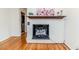 Close-up of the painted brick fireplace with a decorative mantel at 808 N Franklin Dr, Sanford, NC 27330