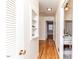 Hallway featuring hardwood floors and built-in shelving at 808 N Franklin Dr, Sanford, NC 27330