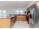 Well-equipped kitchen with stainless steel appliances and warm wood cabinets at 808 N Franklin Dr, Sanford, NC 27330