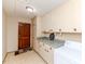 Laundry room with plenty of counter space, abundant cabinet storage, and modern appliances at 808 N Franklin Dr, Sanford, NC 27330