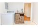 Laundry area featuring a washer and decorated wood storage cabinet at 808 N Franklin Dr, Sanford, NC 27330