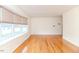 Another view of the expansive living room with lots of natural light and hardwood floors at 808 N Franklin Dr, Sanford, NC 27330