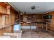 Utility shed interior with shelving and workbench for storage or hobbies at 808 N Franklin Dr, Sanford, NC 27330