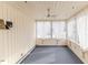 Bright sunroom with neutral walls, curtains, ceiling fan, and carpet flooring at 808 N Franklin Dr, Sanford, NC 27330