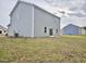 View of the exterior of a two-story home with a sodded lawn at 829 Kenyon Spring Dr, Zebulon, NC 27597