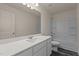 Bathroom with vanity, lighting, and tub with shower at 829 Kenyon Spring Dr, Zebulon, NC 27597