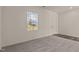 Cozy bedroom with plush carpeting, a large window, and ample space at 829 Kenyon Spring Dr, Zebulon, NC 27597
