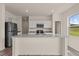 Modern kitchen featuring granite countertops, stainless steel appliances, and an island at 829 Kenyon Spring Dr, Zebulon, NC 27597