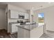 Bright kitchen with granite countertops, stainless steel appliances, and a large island at 829 Kenyon Spring Dr, Zebulon, NC 27597