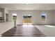 Open living area with hardwood floors, natural light, and sliding glass doors at 829 Kenyon Spring Dr, Zebulon, NC 27597