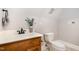 Bathroom featuring toilet and single sink wooden vanity at 8418 Wheatstone Ln, Raleigh, NC 27613