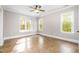 Spacious bedroom with three windows allowing plenty of natural light at 8418 Wheatstone Ln, Raleigh, NC 27613