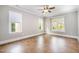 Bright and airy bedroom with three windows and neutral tones at 8418 Wheatstone Ln, Raleigh, NC 27613