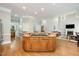 Island kitchen with granite countertops, stainless steel appliances, recessed lighting, and hardwood flooring at 8418 Wheatstone Ln, Raleigh, NC 27613