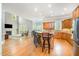 Open-concept kitchen flows into the living area, showcasing a large island and stainless steel appliances at 8418 Wheatstone Ln, Raleigh, NC 27613