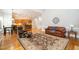 Inviting living room seamlessly connects to the open kitchen, features hardwood floors and neutral decor at 8418 Wheatstone Ln, Raleigh, NC 27613