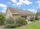 Spacious backyard featuring a patio area, lush greenery, and outdoor seating at 8437 Little Woody Ct, Zebulon, NC 27597